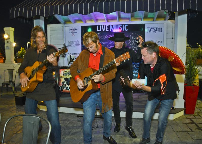 Hot Sauce Band kicks it on the Bluecoast patio Oct. 18. Shown (l-r) are David Aman, James Davis, Michael Shockley and Mike Suplee. DENY HOWETH PHOTO
